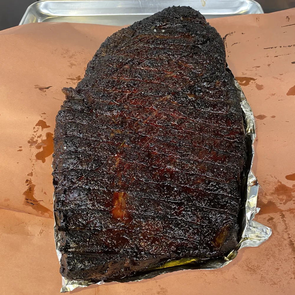 A whole smoked brisket on butcher paper