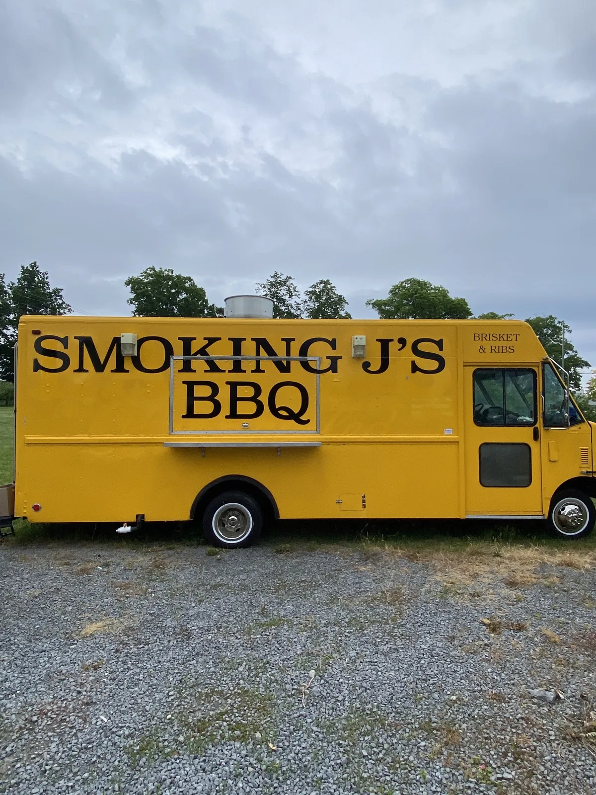 The yellow Smoking J's BBQ truck